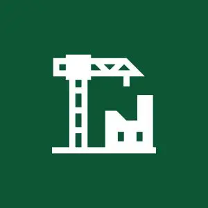 Crane and building icon on green background.